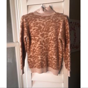 Super soft leopard print turtleneck sweater.